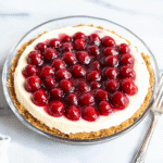 A Sweet Slice of Nostalgia: The Story Behind No Bake Cherry Cheesecake Dessert 5 No bake cherry cheesecake dessert with cherry topping and graham cracker crust