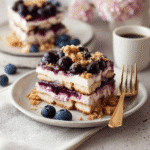 Vegan Blueberry Crumble Tiramisu – A Fruity, Creamy No-Coffee Delight 5 Vegan Blueberry Crumble Tiramisu slice on a plate